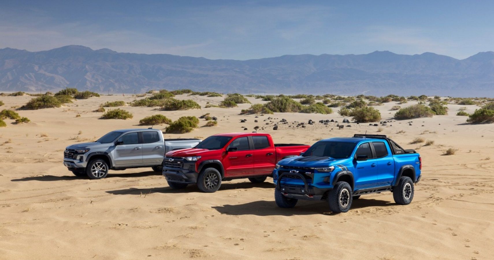 Three versions of the 2023 Chevrolet Colorado on sand