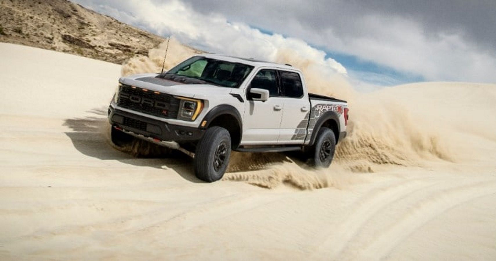 2023 Ford F-150 Raptor R driving on sand