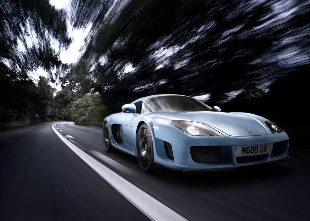 Blue 2010 Noble M600 driving 