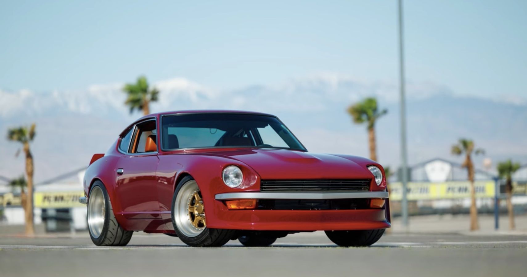 A restomod red Datsun 240Z with an LS V8 engine swap