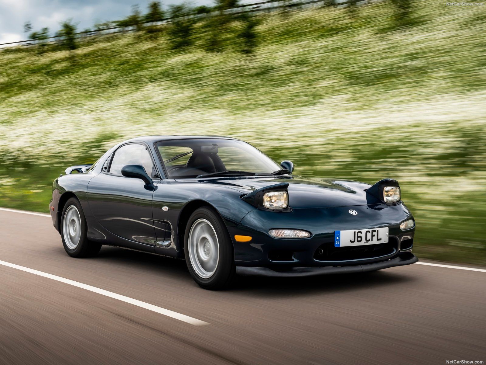 Mazda RX-7 FD, black, on road, front quarter view