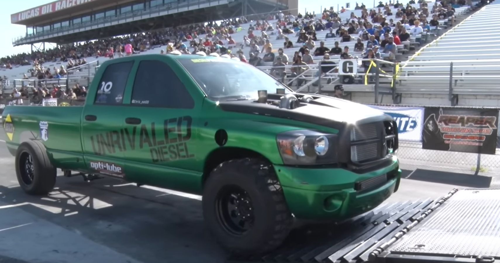 Front quarter view of green 2,600 horsepower Dodge Ram at event
