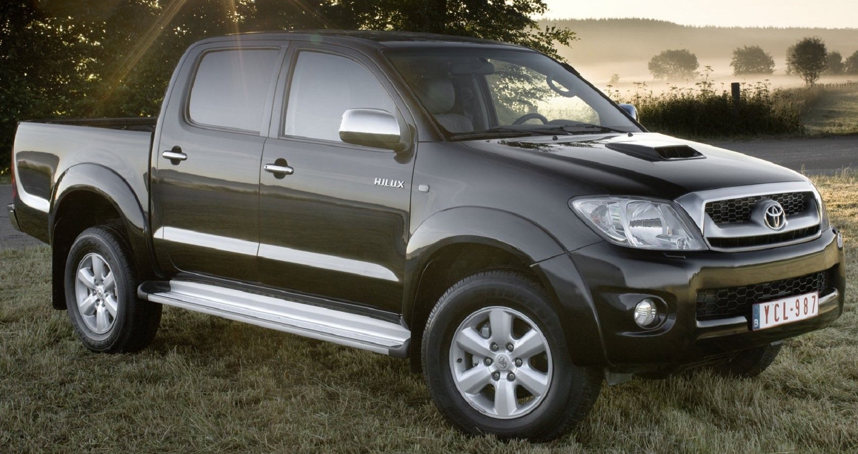 Toyota Hilux 2009, black, front quarter view on field