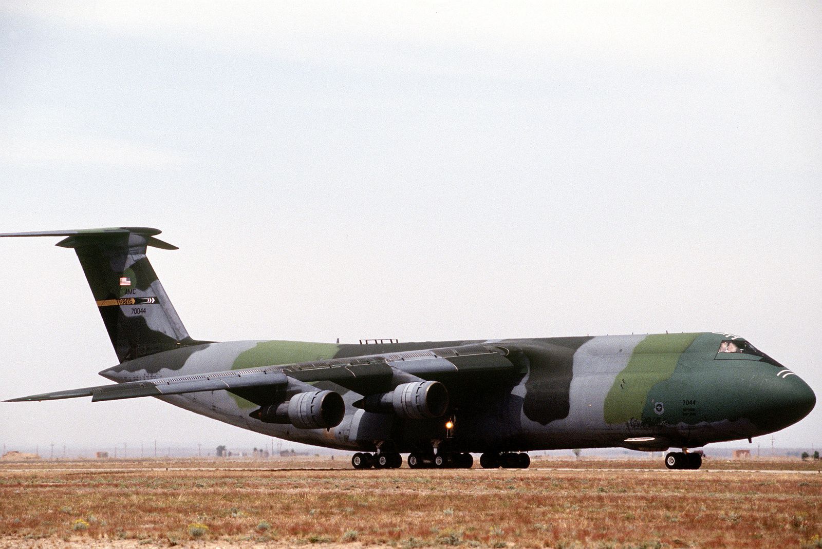a-side-view-of-a-c-5-galaxy-in-camouflage-paint-from-travis-afb-ca-taxis-down-35e55e-1600