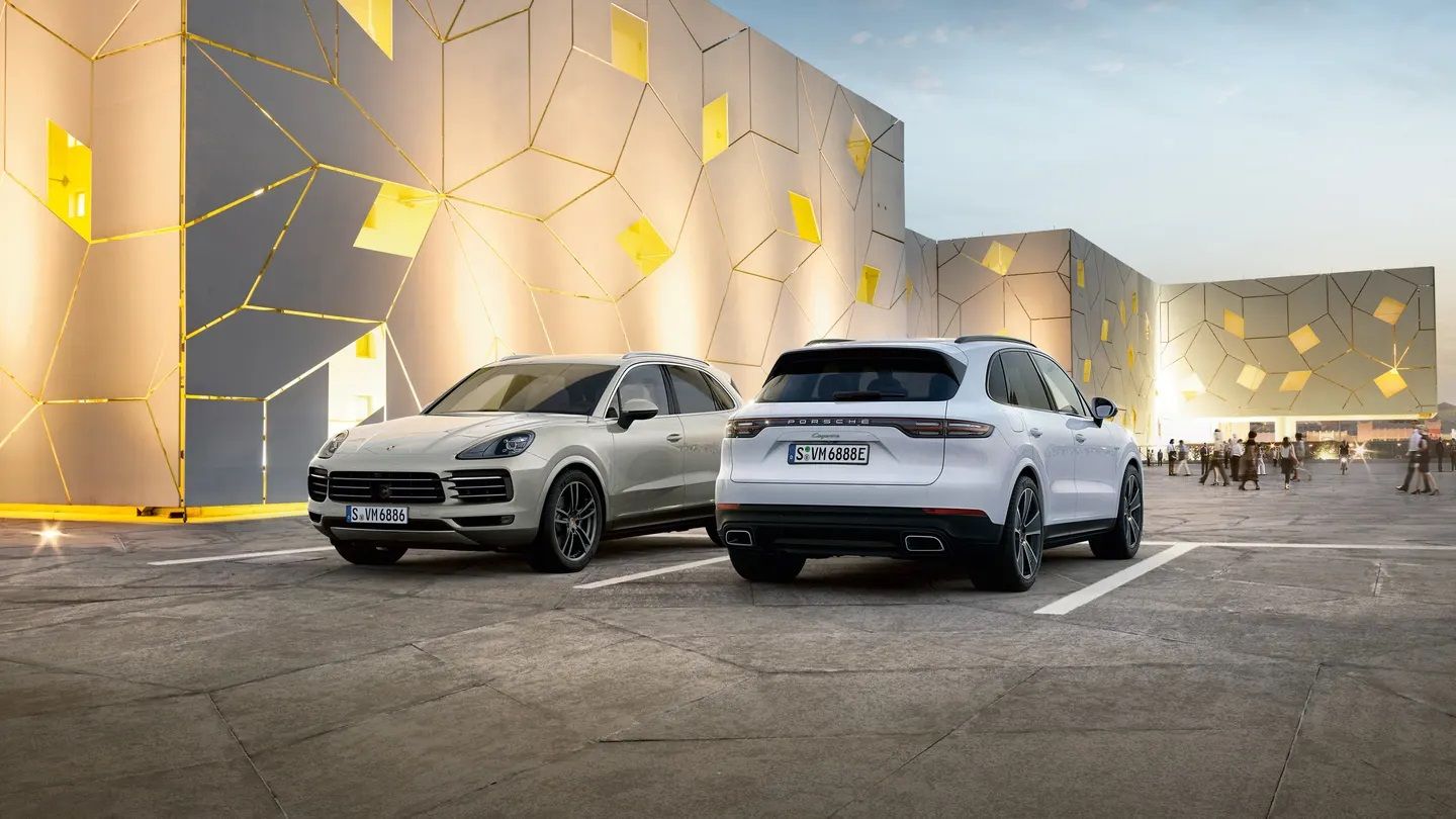 The Porsche Cayenne SUV and Coupe side by side. 