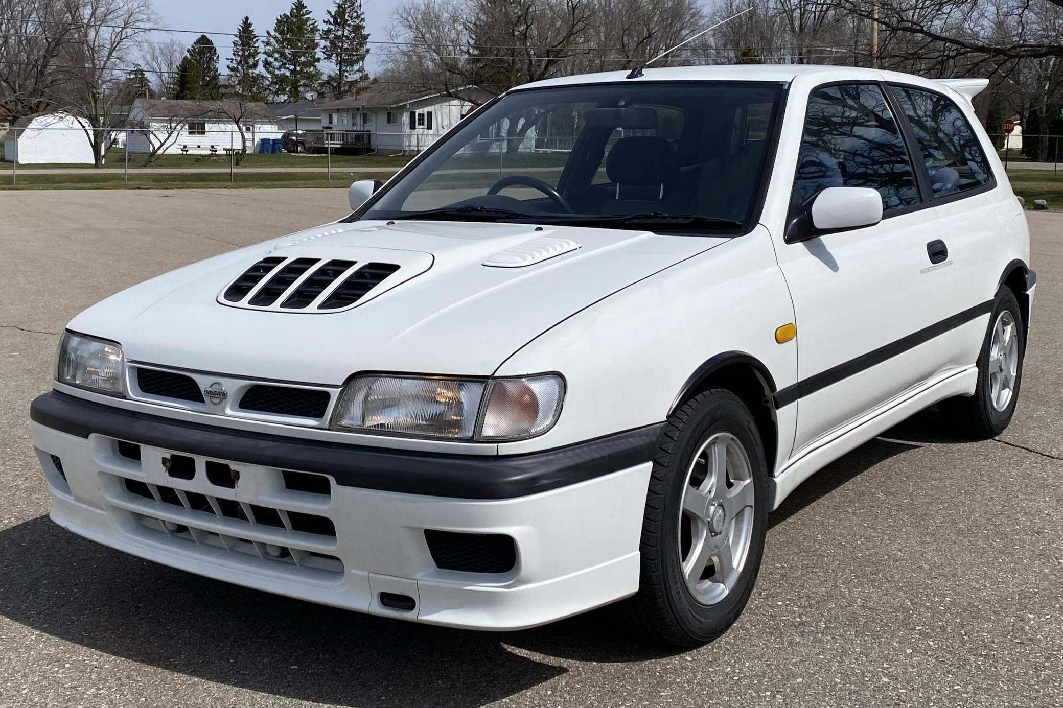 A white 1994 Nissan Pulsar GTI-R, parked
