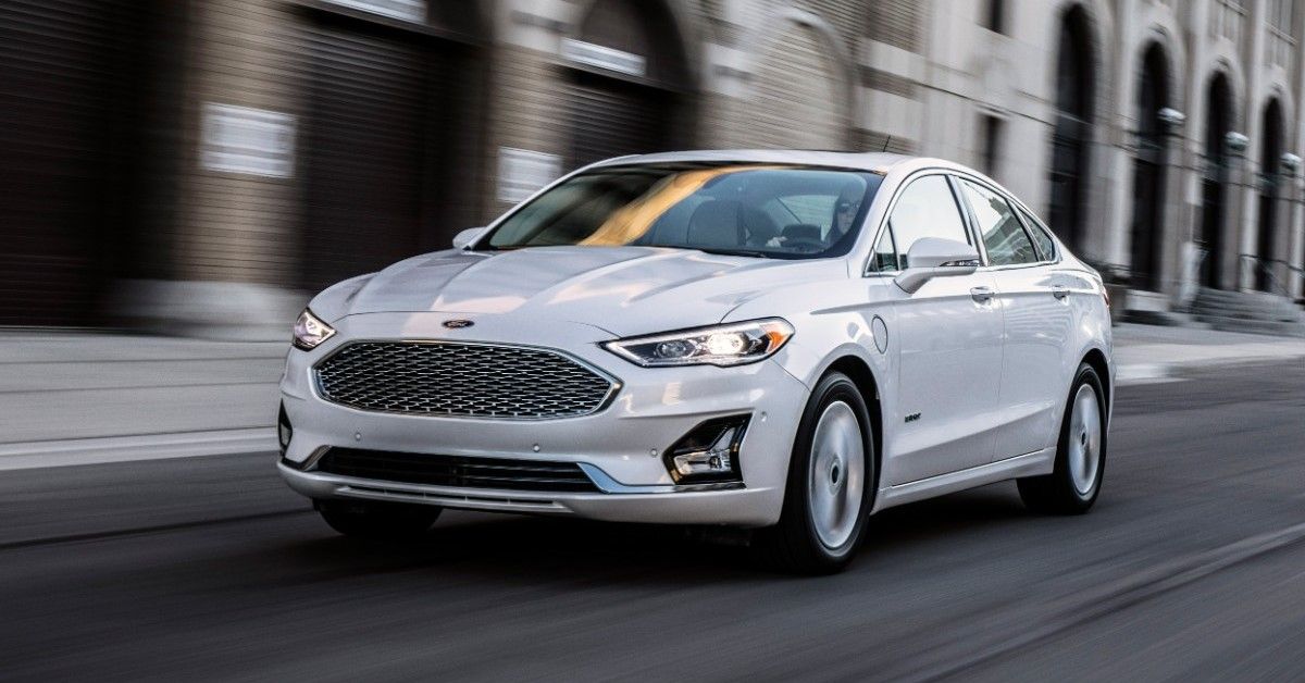 The 2020 Ford Fusion speeds up on the road. 