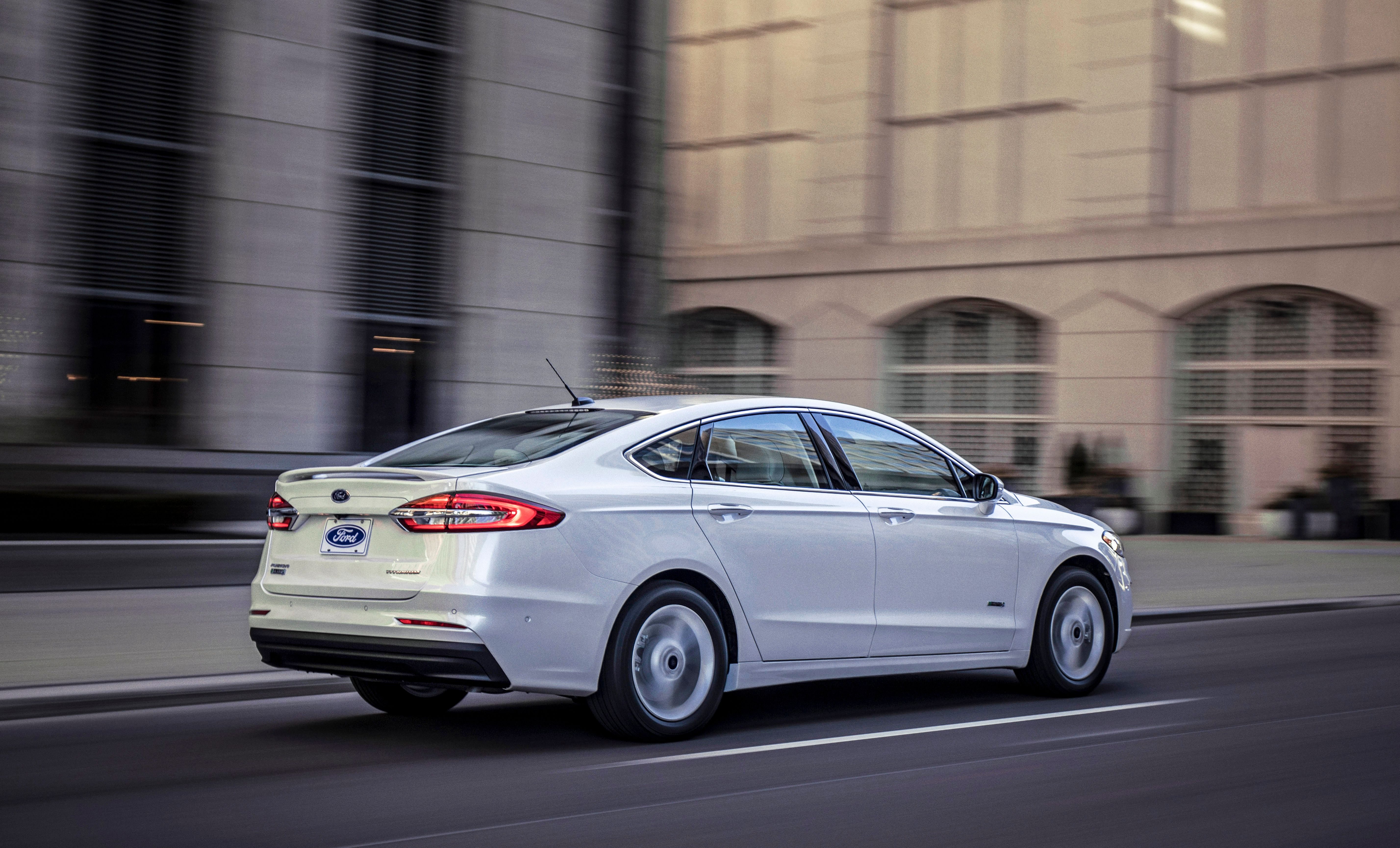 White Ford Fusion on the road