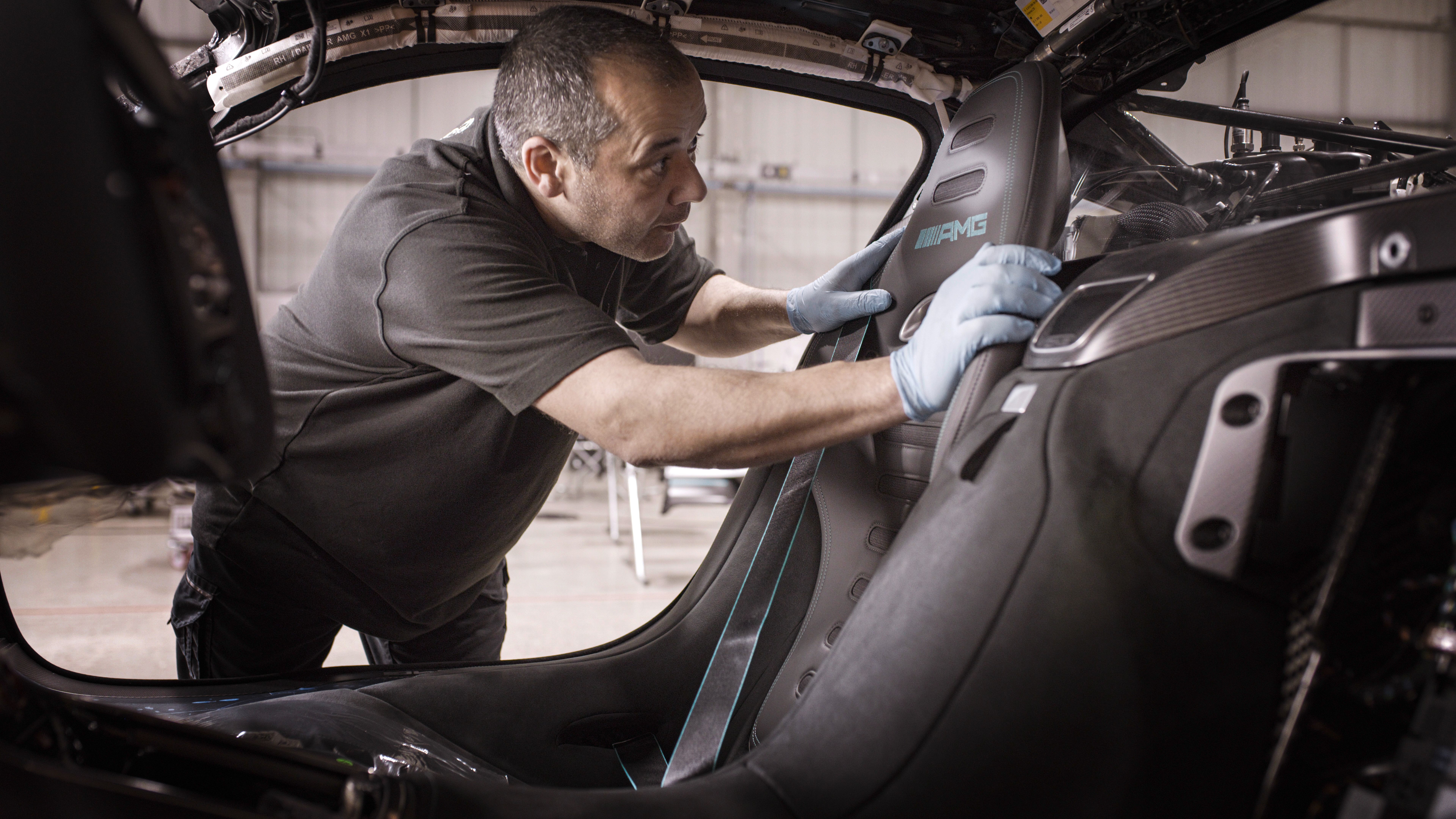 An employee from Mercedes-AMG works on a project. 