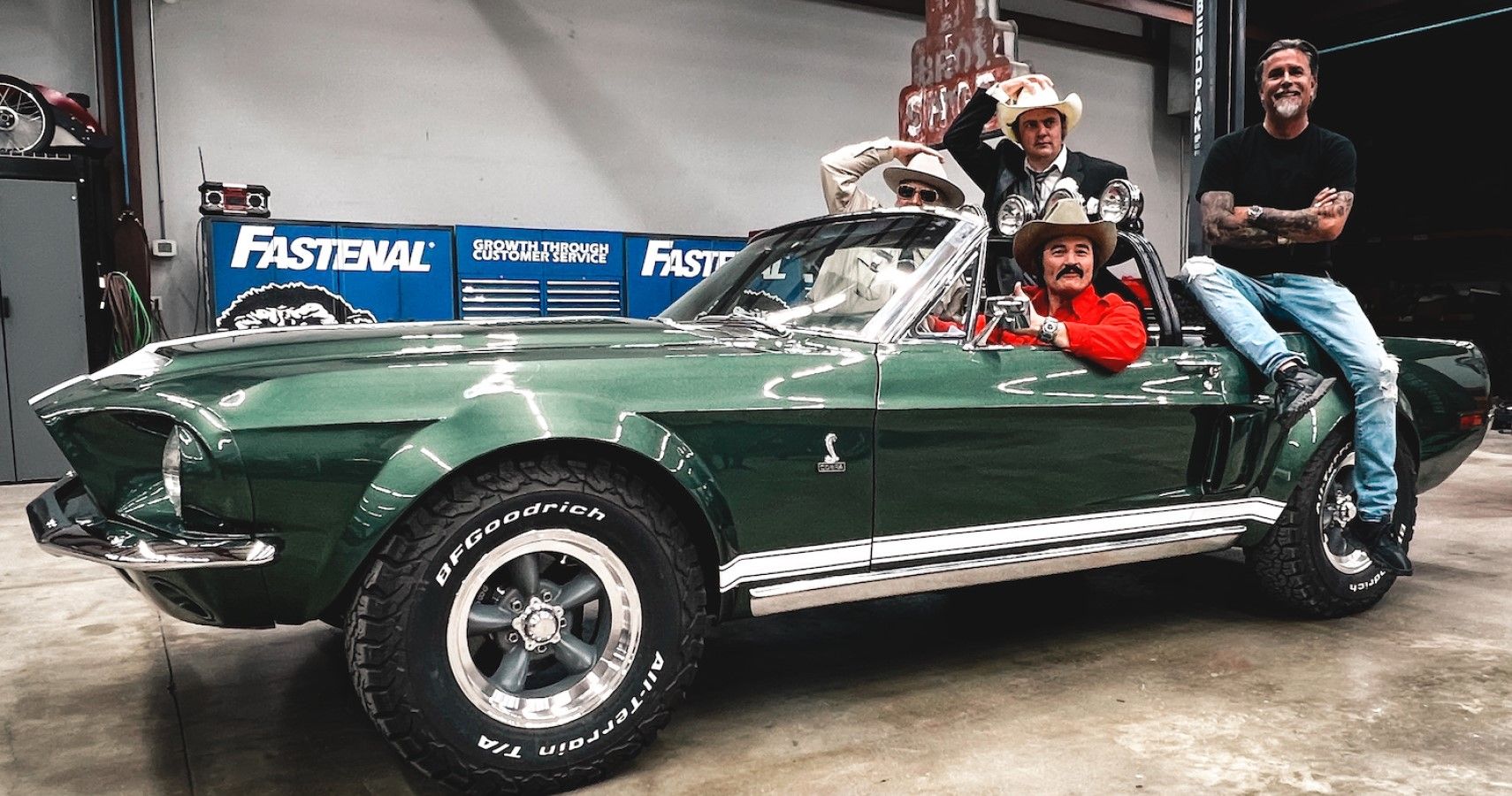 Richard Rawlings posing with a tricked-out Ford Mustang