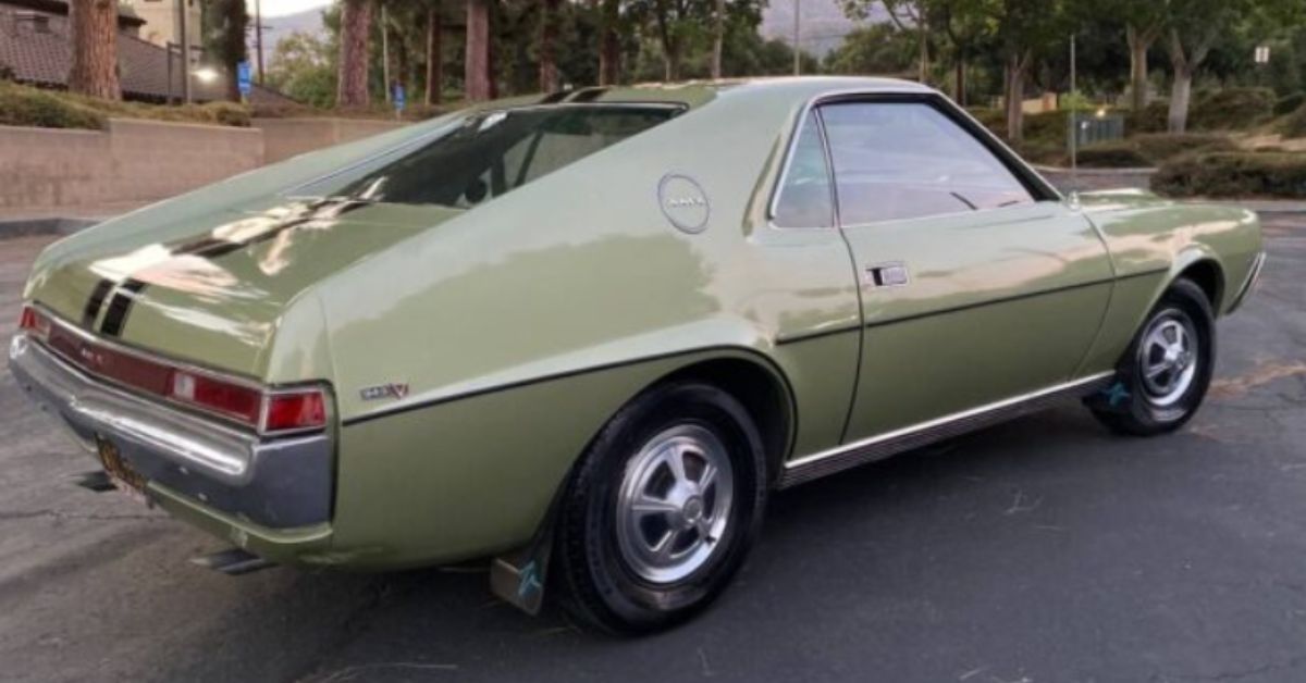 Green AMC AMX on the road