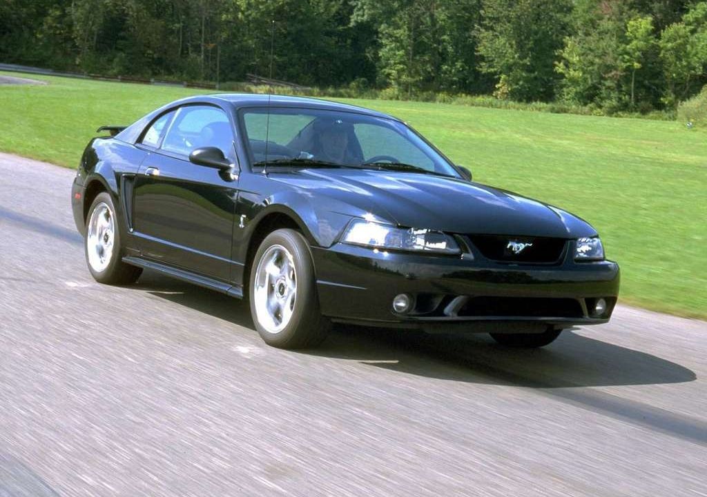 Black 2001 Ford Mustang SVT Cobra driving 