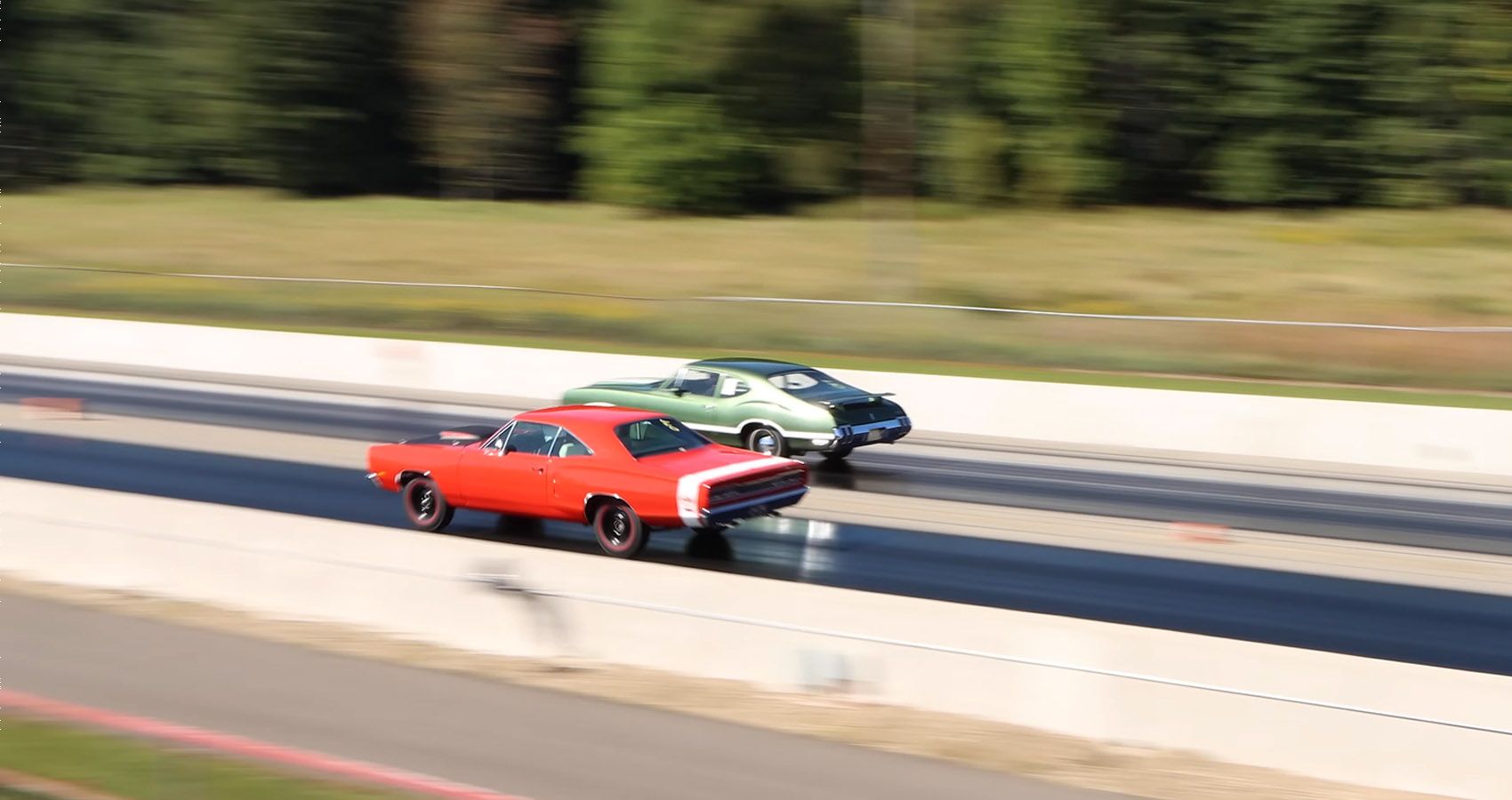 Stock Drag Race Between A 1969 Dodge Super Bee A12 And A 1970 Oldsmobile F85 W 31