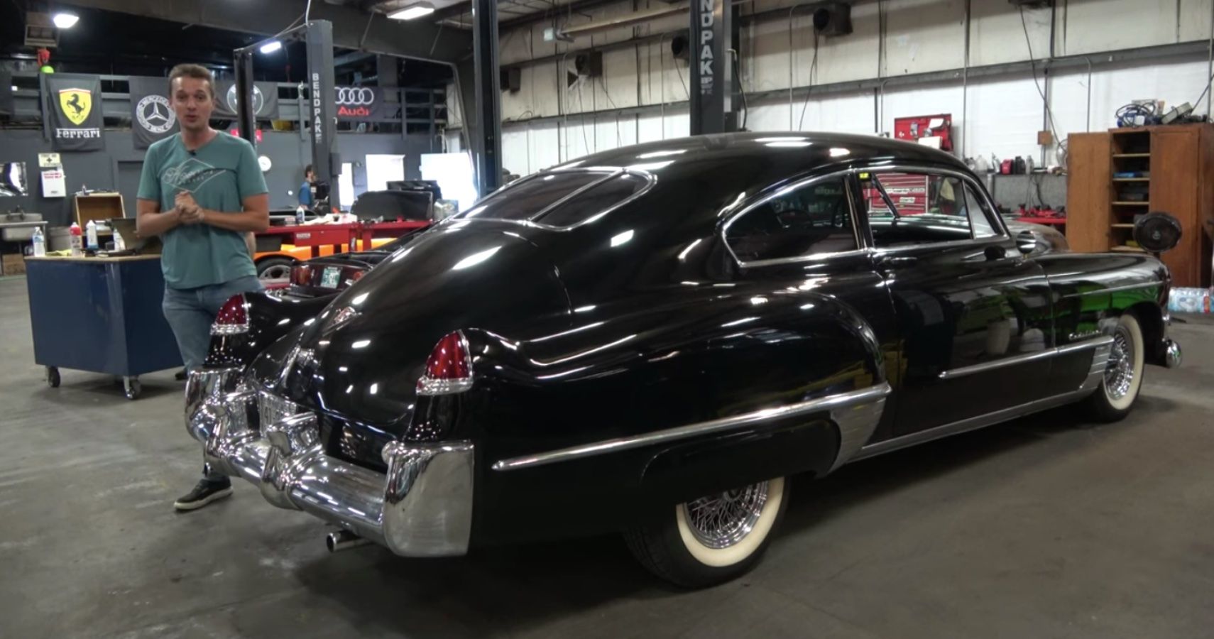 Black Cadillac, black, in garage, rear quarter view