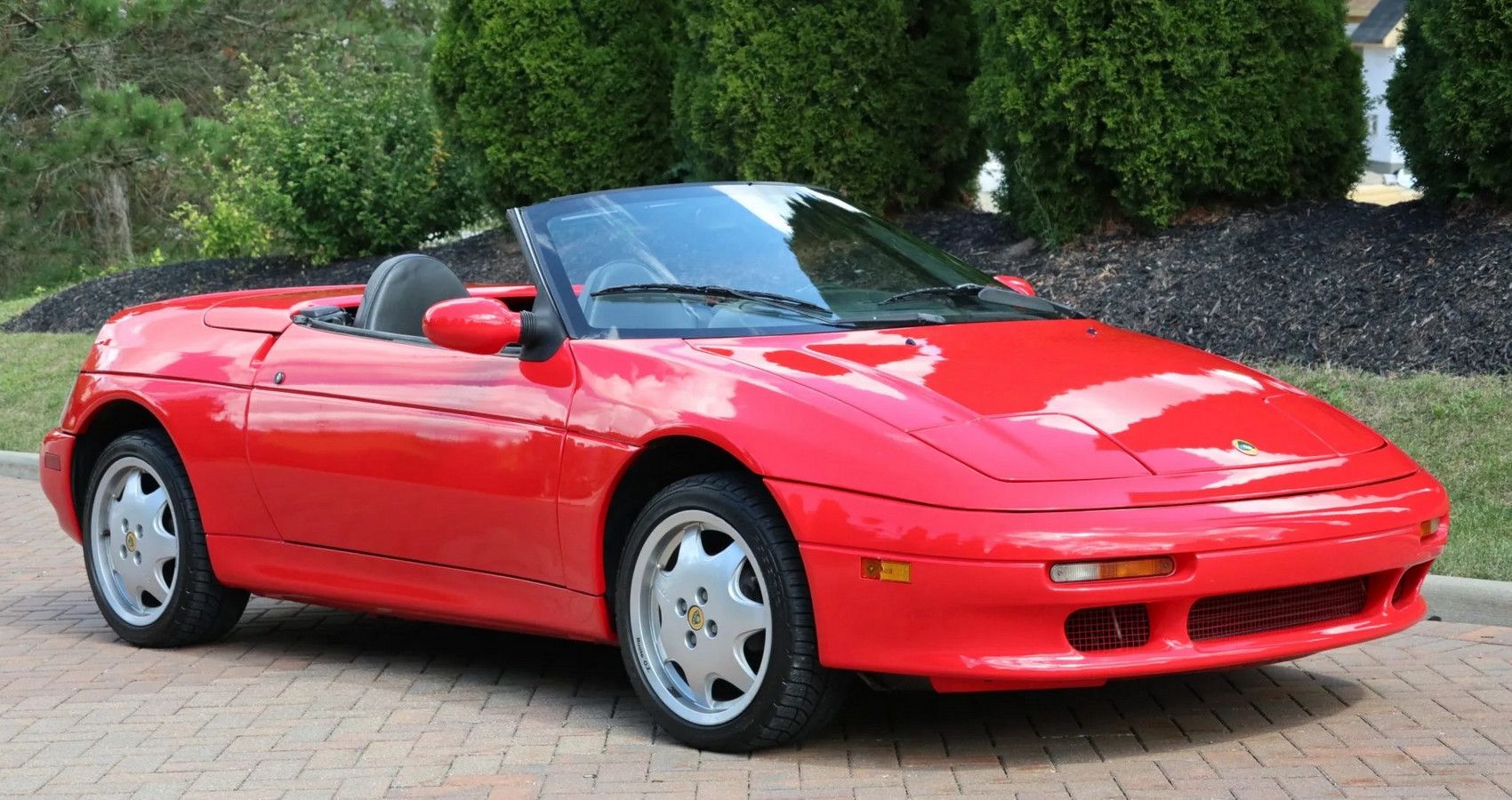 Red Lotus Elan M100 on the driveway