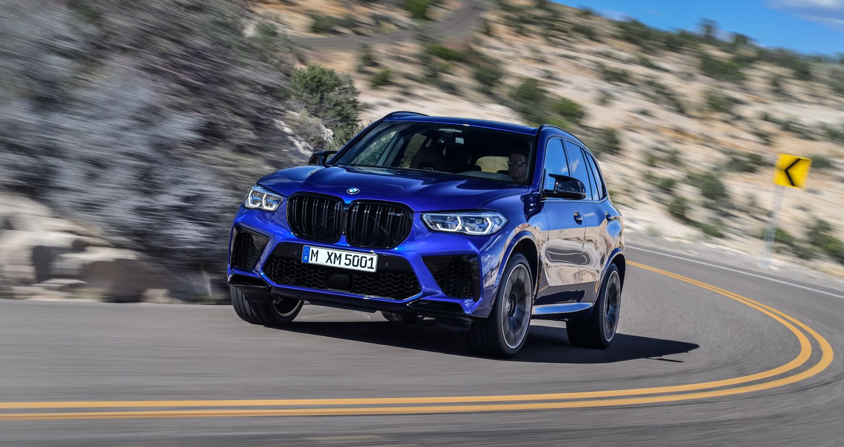 2023 BMW X4 M Competition Front Three Quarter Driving On Road