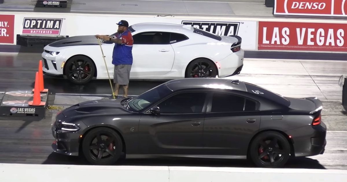 Wheels YouTube Channel Camaro SS VS Charger Hellcat Side view at track