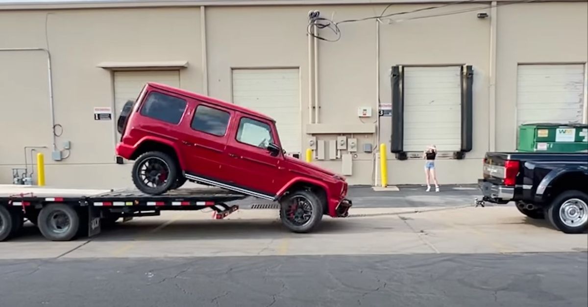 WhistlinDiesel YouTube Channel Mercedes G Wagon being towed off the trailer 