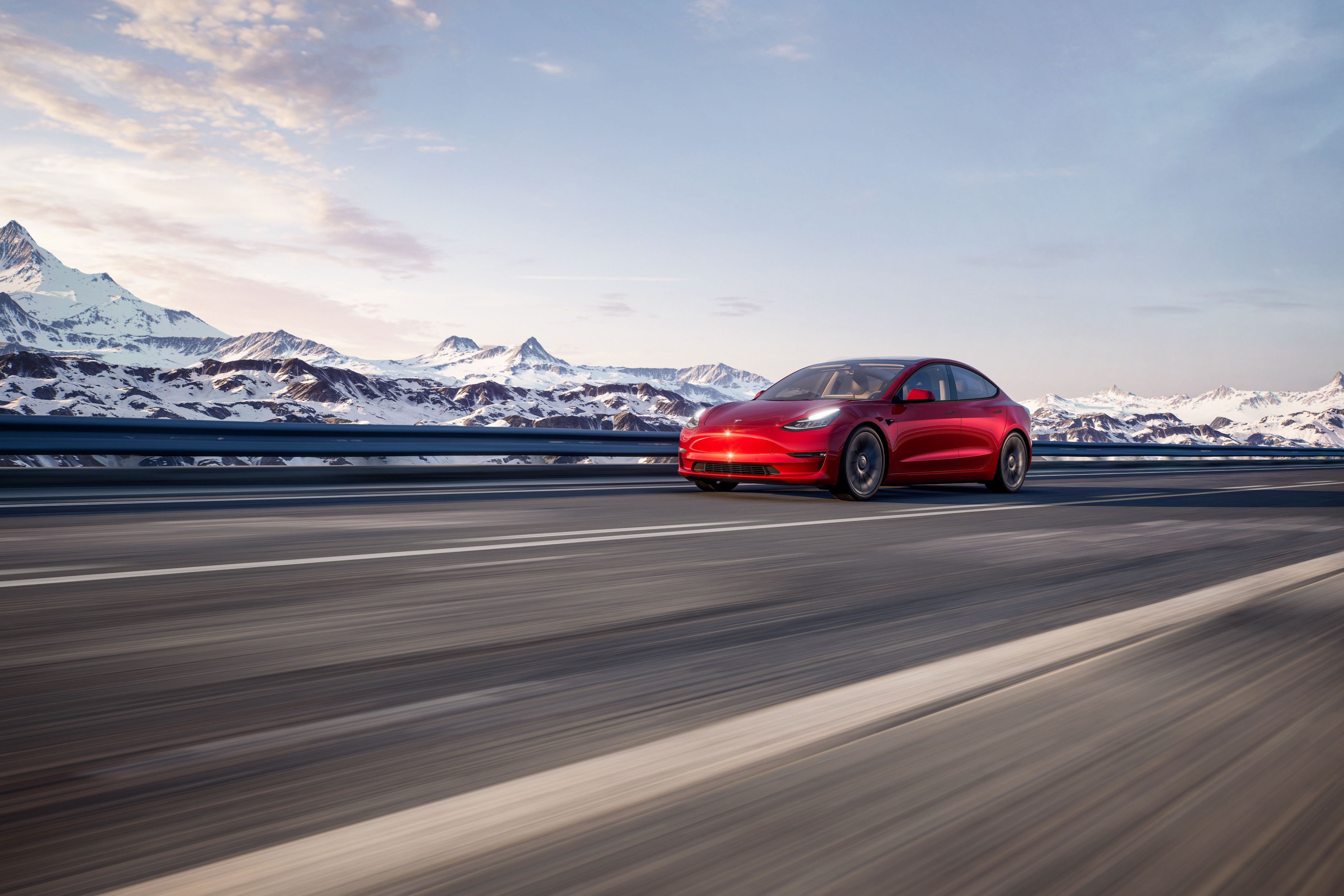 Red Tesla Model 3 Performance on the move