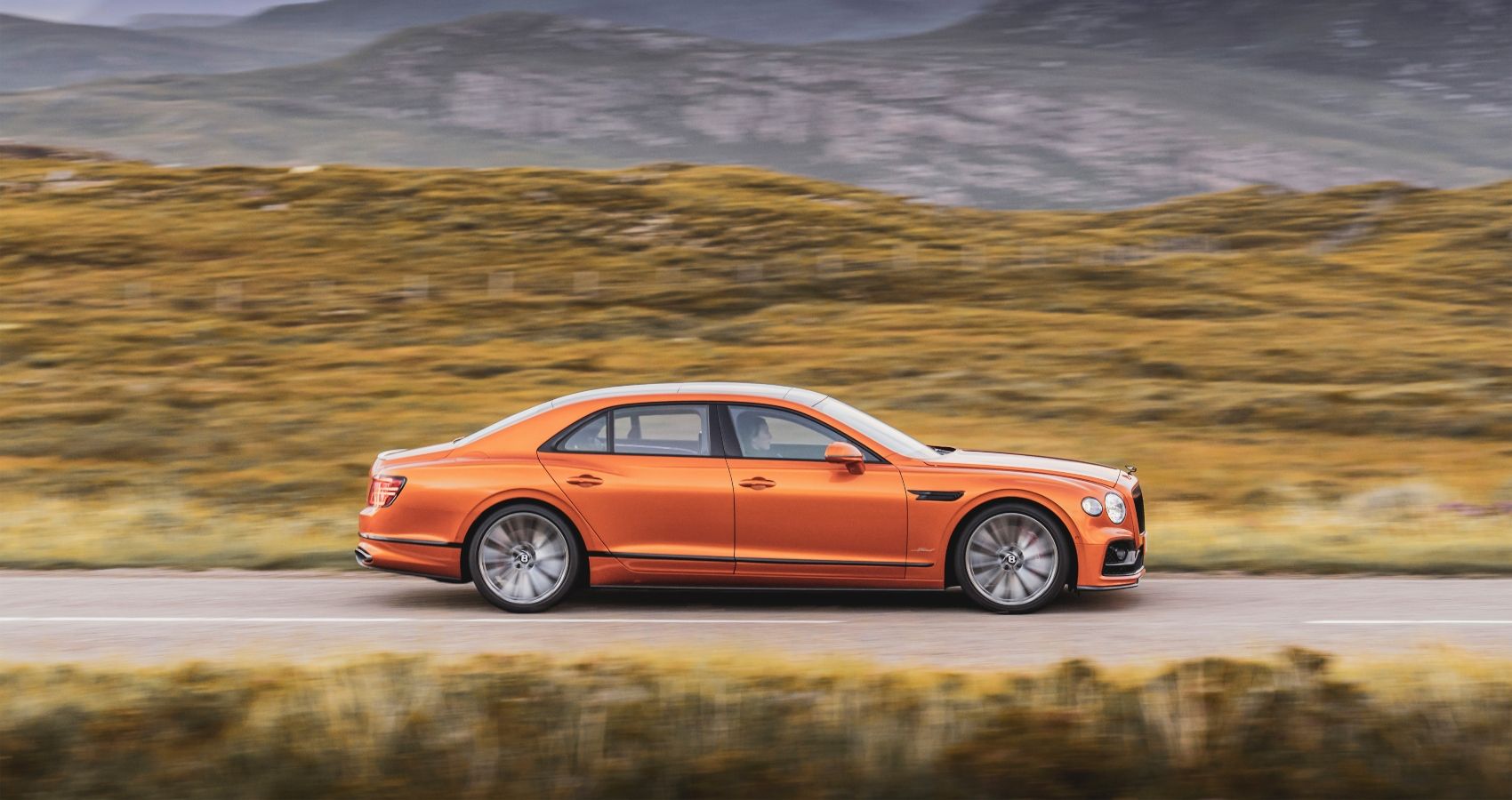 Side profile of the 2023 Bentley Flying Spur Speed in motion