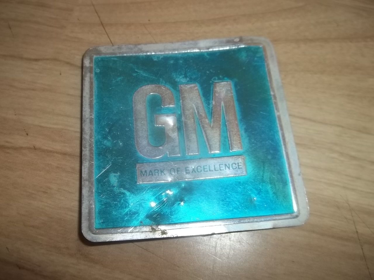 The GM's Mark of Excellence plate
