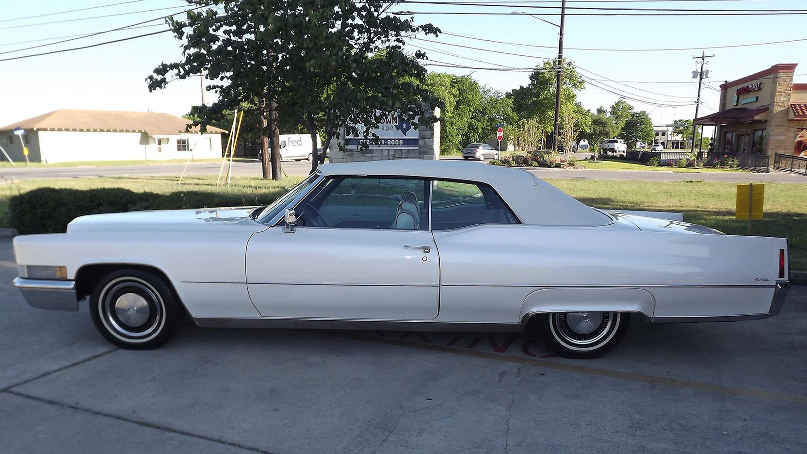 White 1970 Cadillac DeVille on the driveway