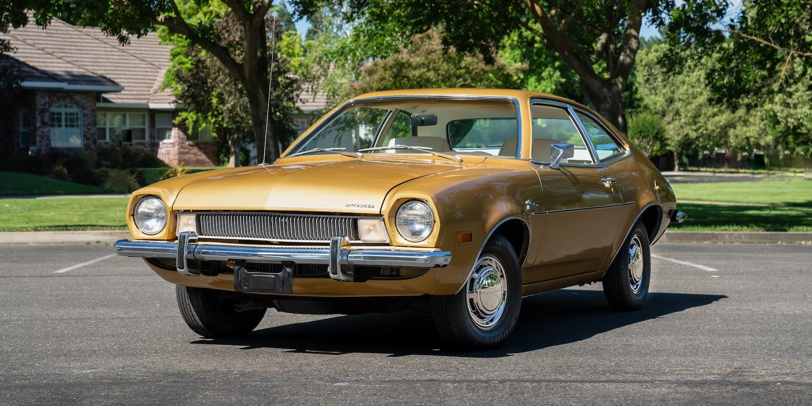 Brown 1973 Ford Pinto parked outside