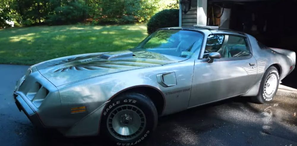 A 1979 Pontiac Trans Am 10th Anniversary Edition emerging from its garage