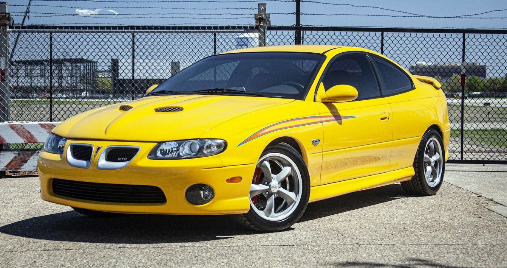 Yellow 2004 Pontiaco GTO Parked Outside