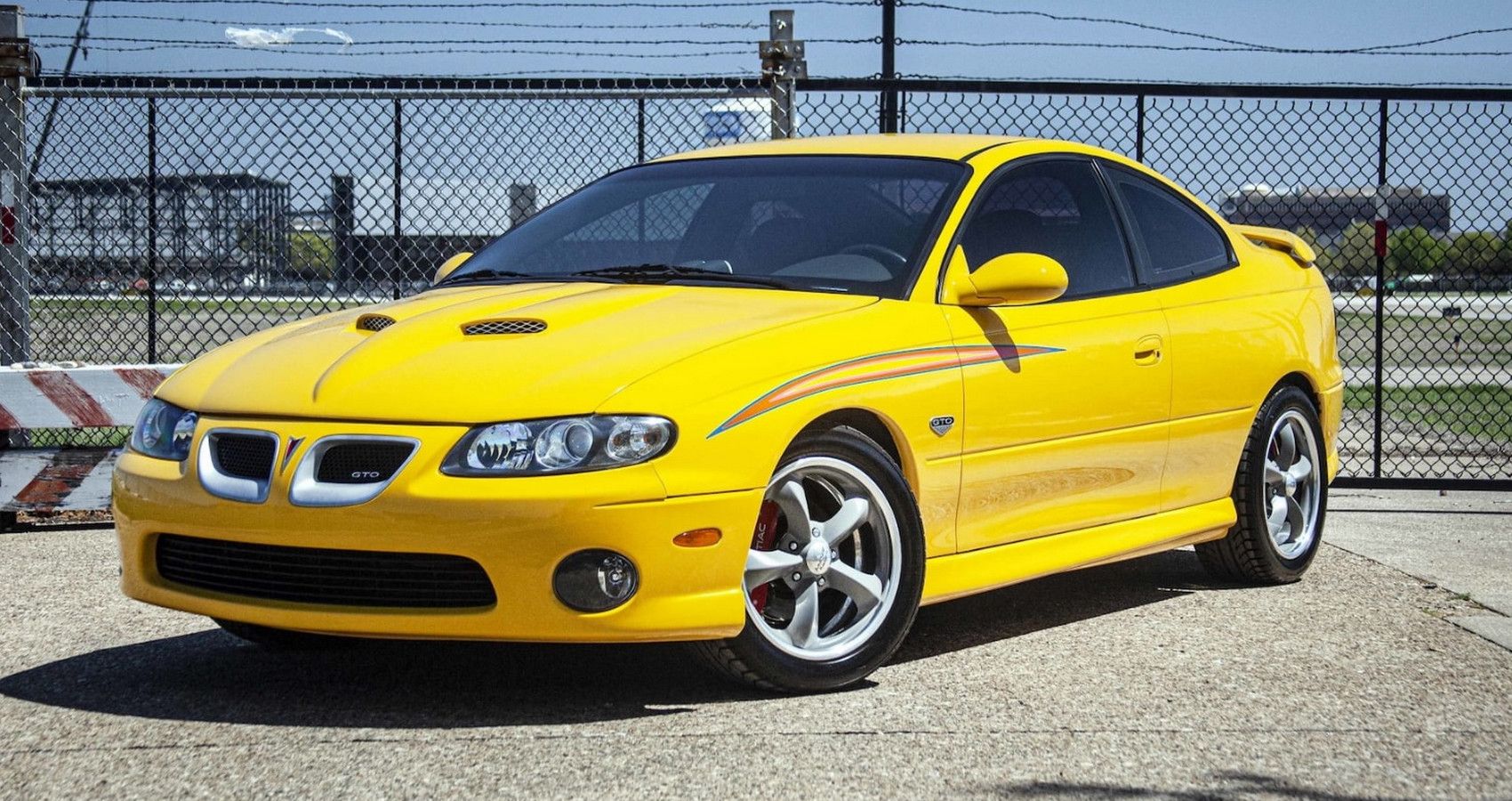 Yellow 2004 Pontiaco GTO  Parked Outside - front