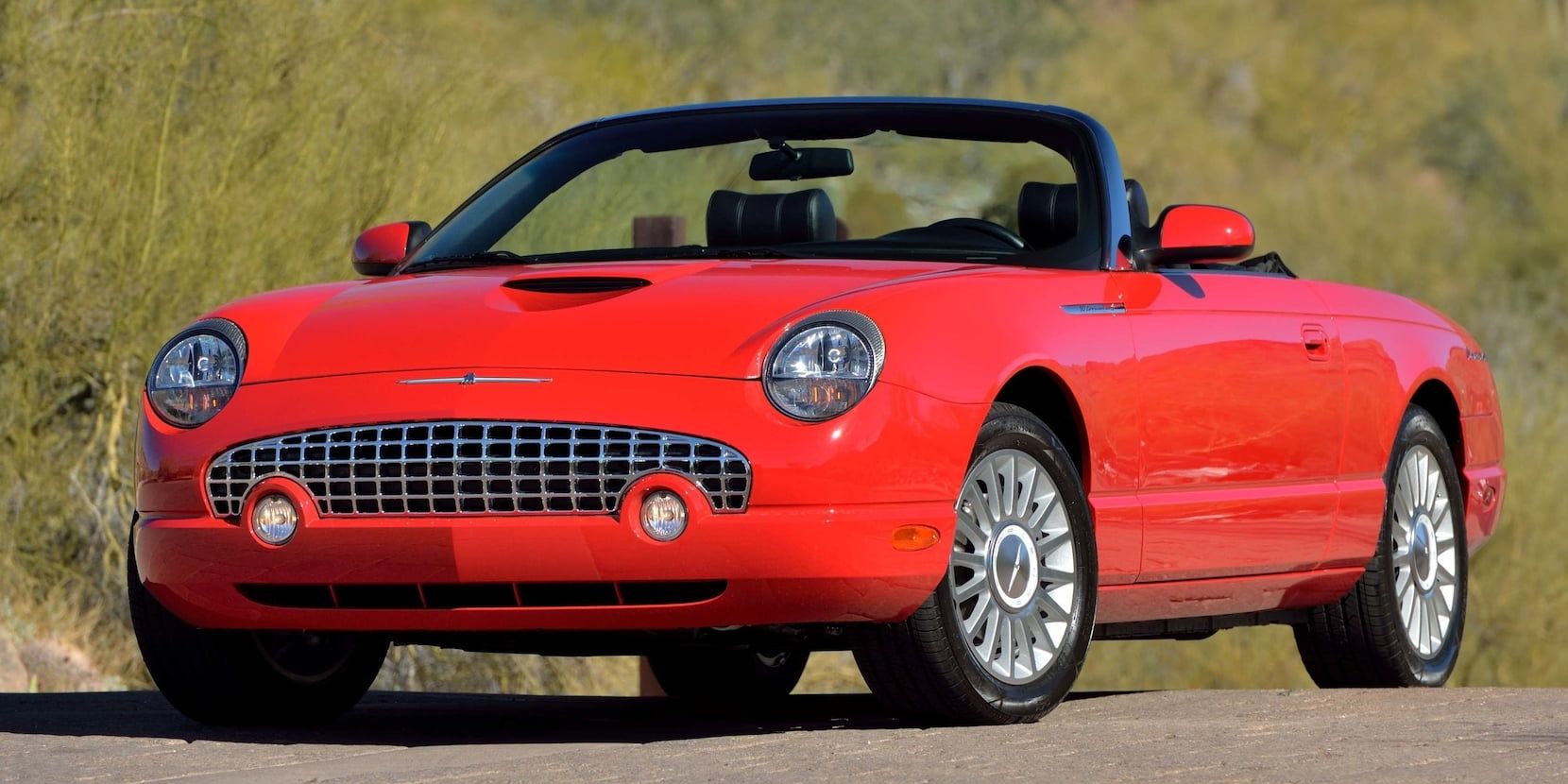 Red 2005 Ford Thunderbird on the road
