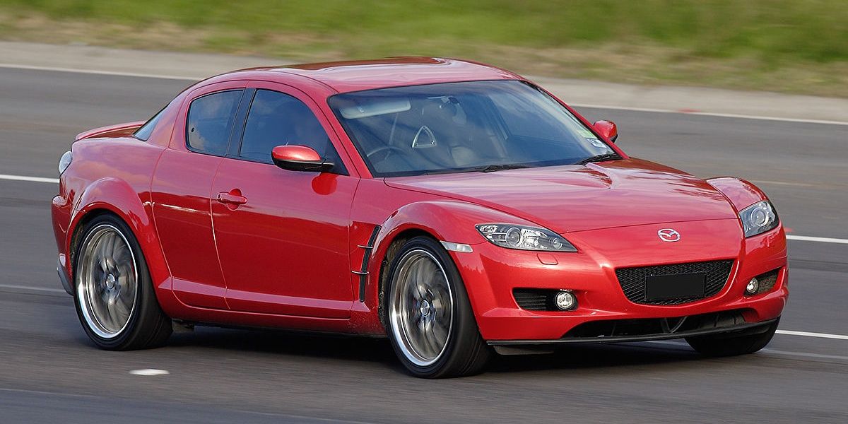 2008 Mazda RX-8 driving down the street