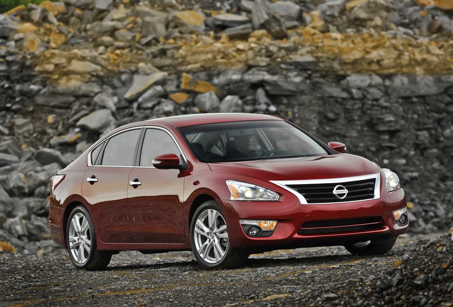 Red 2013 Nissan Altima on the road