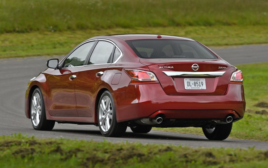 Red 2013 Nissan Altima on the road
