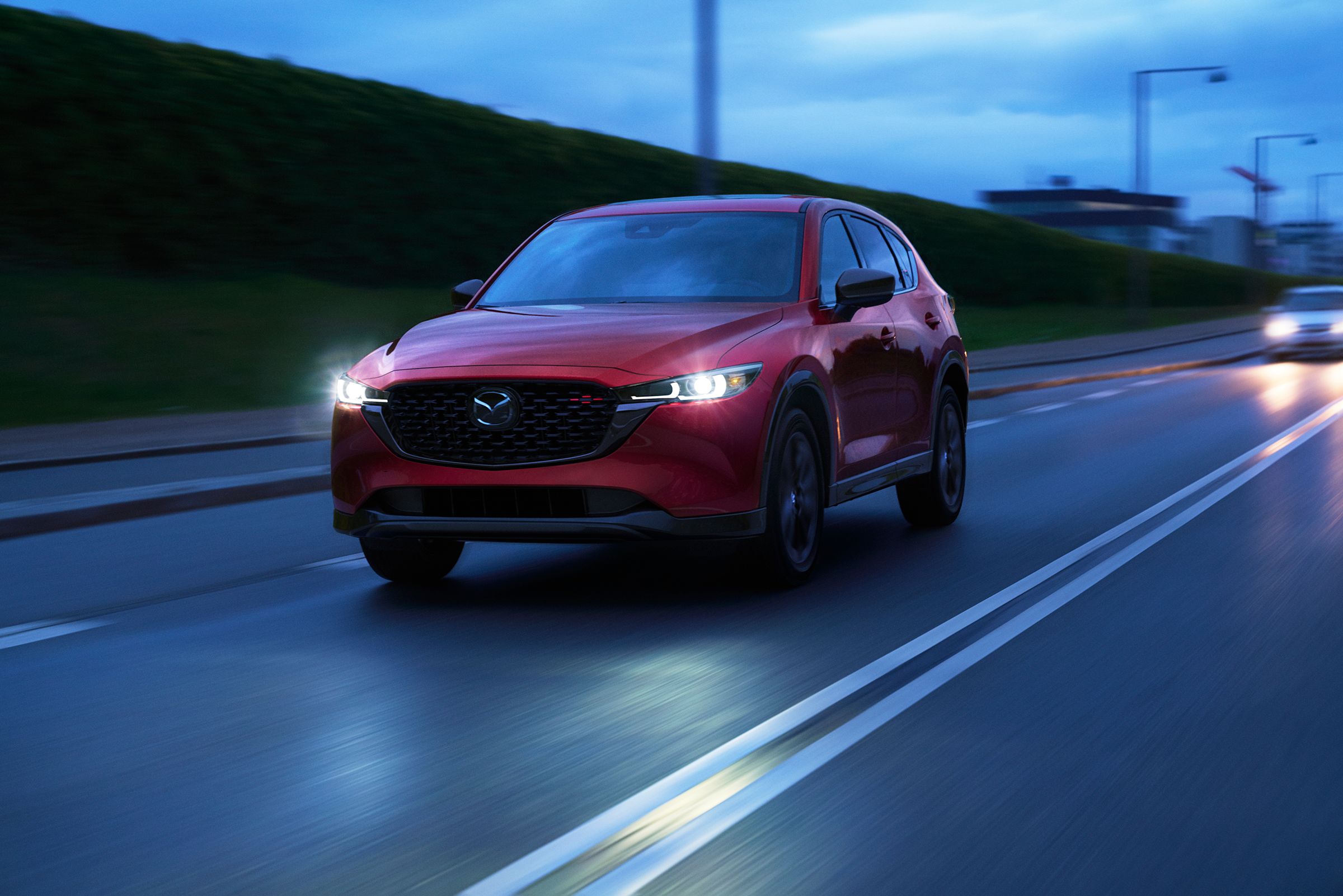 Red 2023 Mazda CX-5 on the road