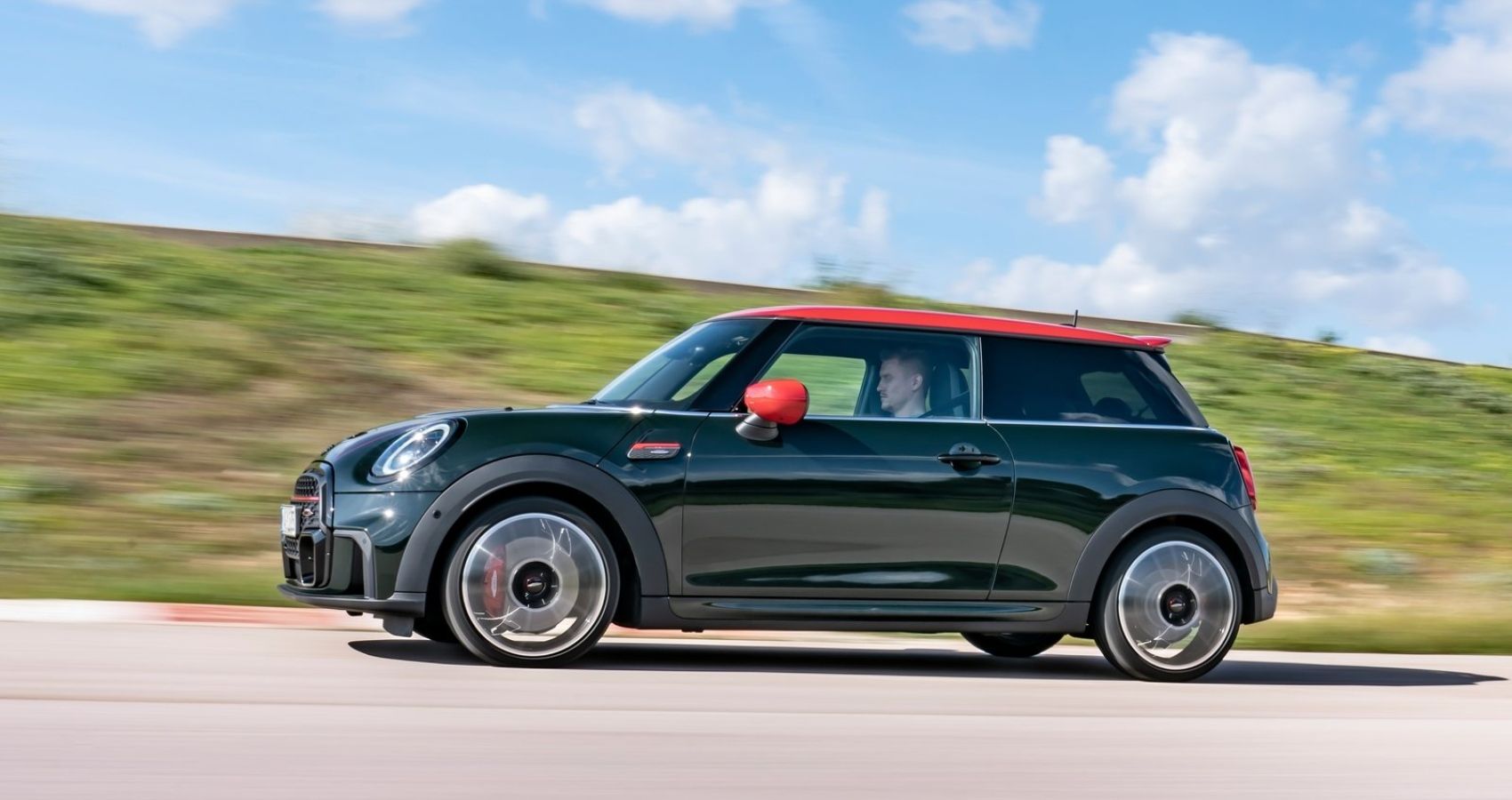 Side profile of the 2022 Mini Cooper JCW in motion