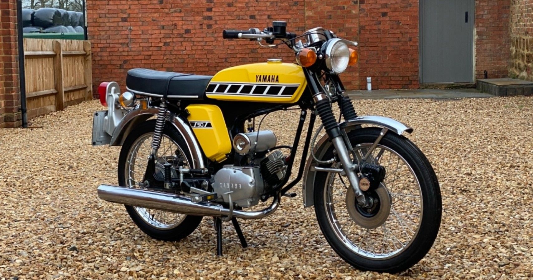 Yamaha FS1-E in yellow front third quarter view