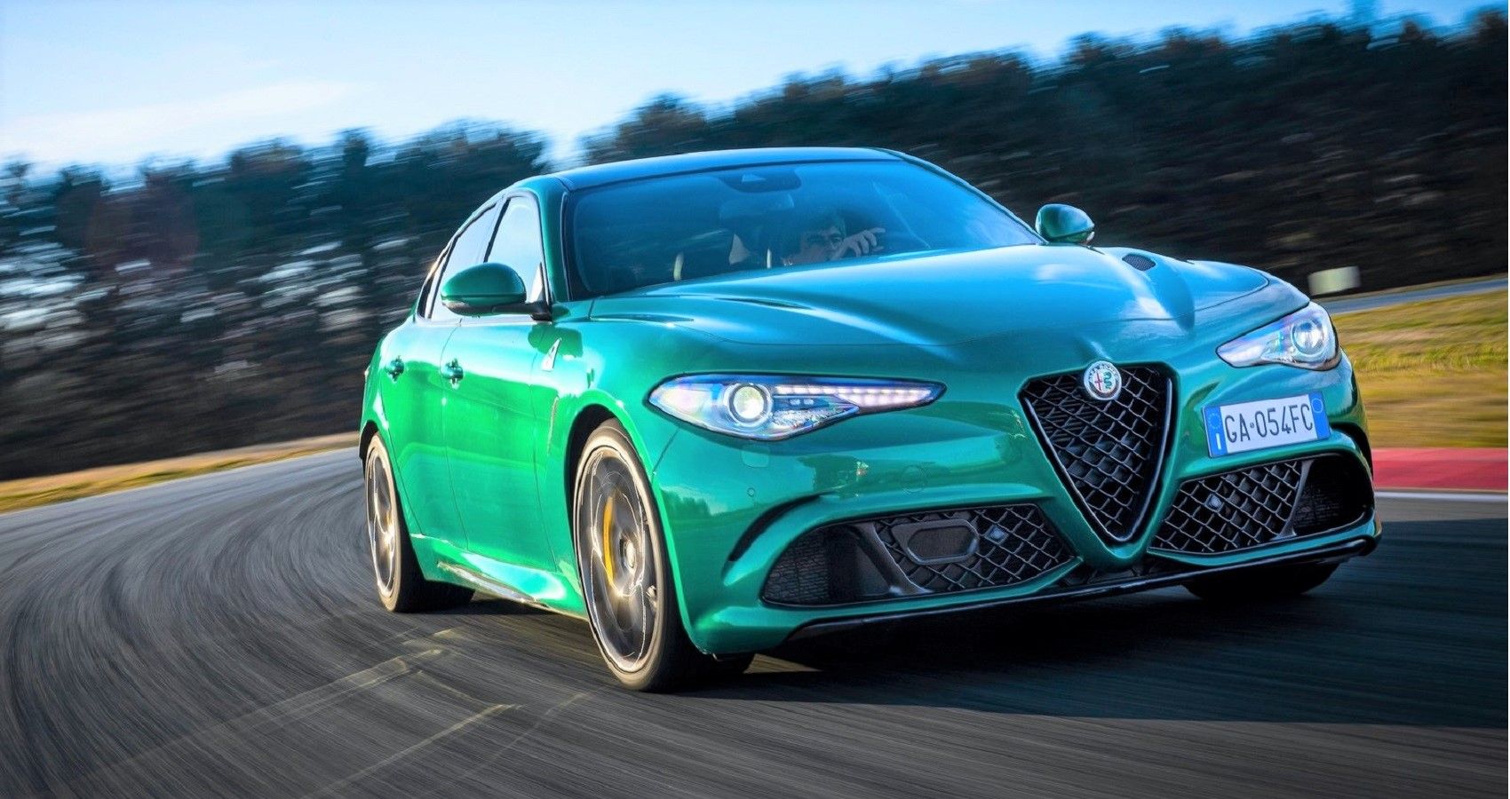 Green 2022 Alfa Romeo Giulia Quadrifoglio on track