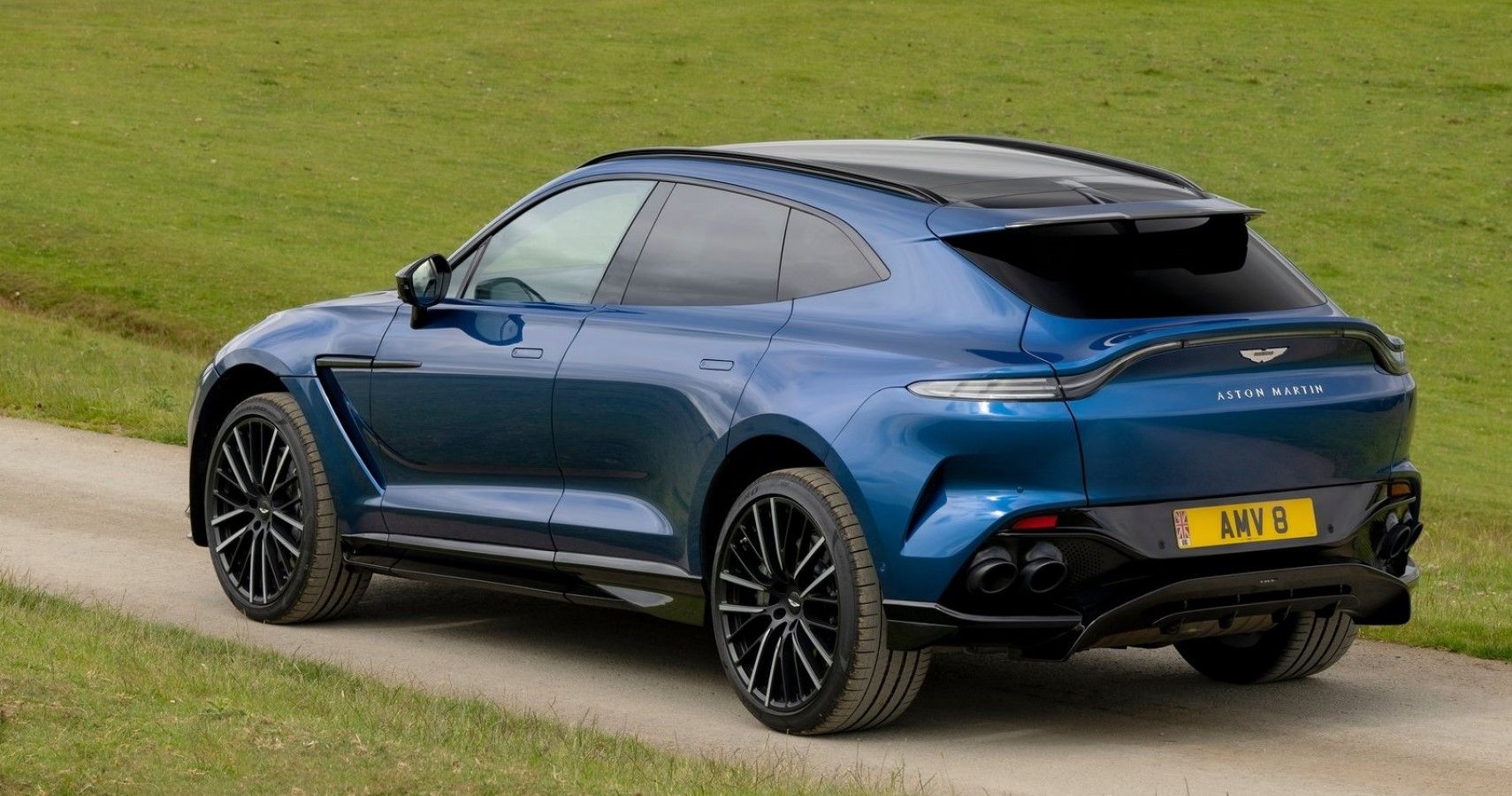 Aston Martin DBX707 rear third quarter view in blue