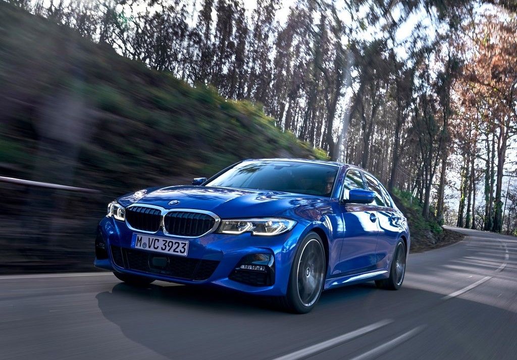 Blue 2019 BMW 3-Series Driving Through The Mountains