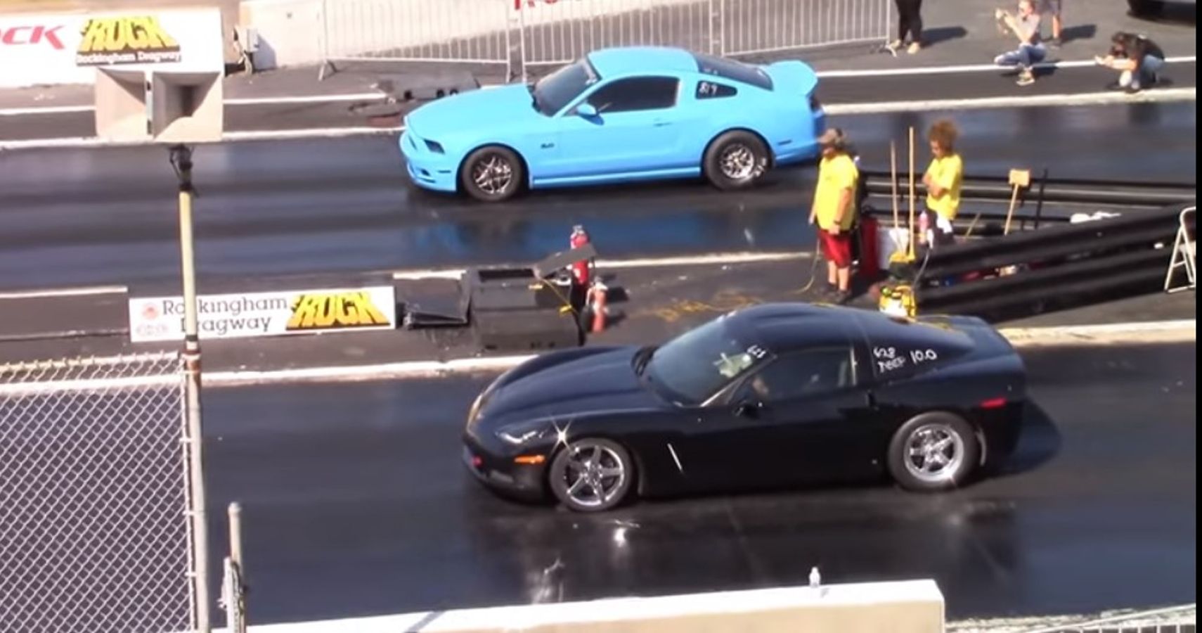 Supercharged black C6 Chevrolet Corvette vs Grabber Blue Ford Mustang S197 5.0