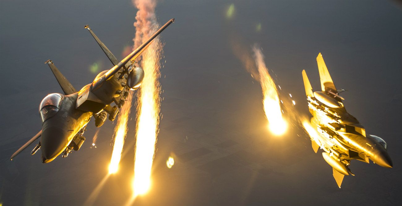 F-15E Strike Eagles Deploying Flares And Splitting Formation