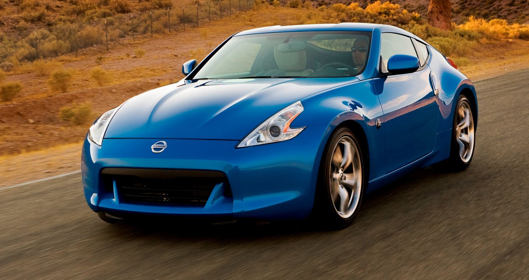 Blue Nissan 370Z on the road