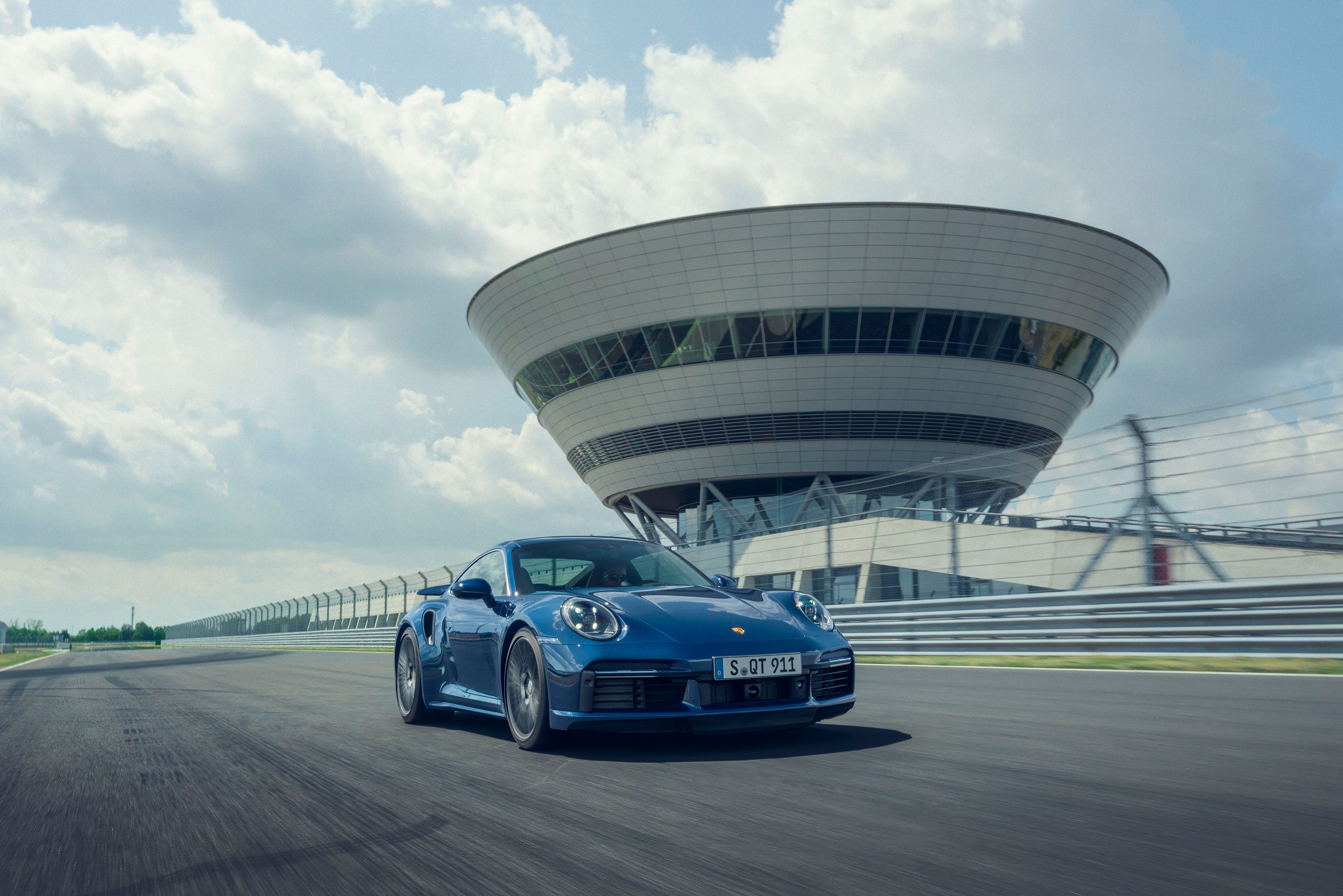 The 2020 Porsche 911 Turbo speeds up on the track. 