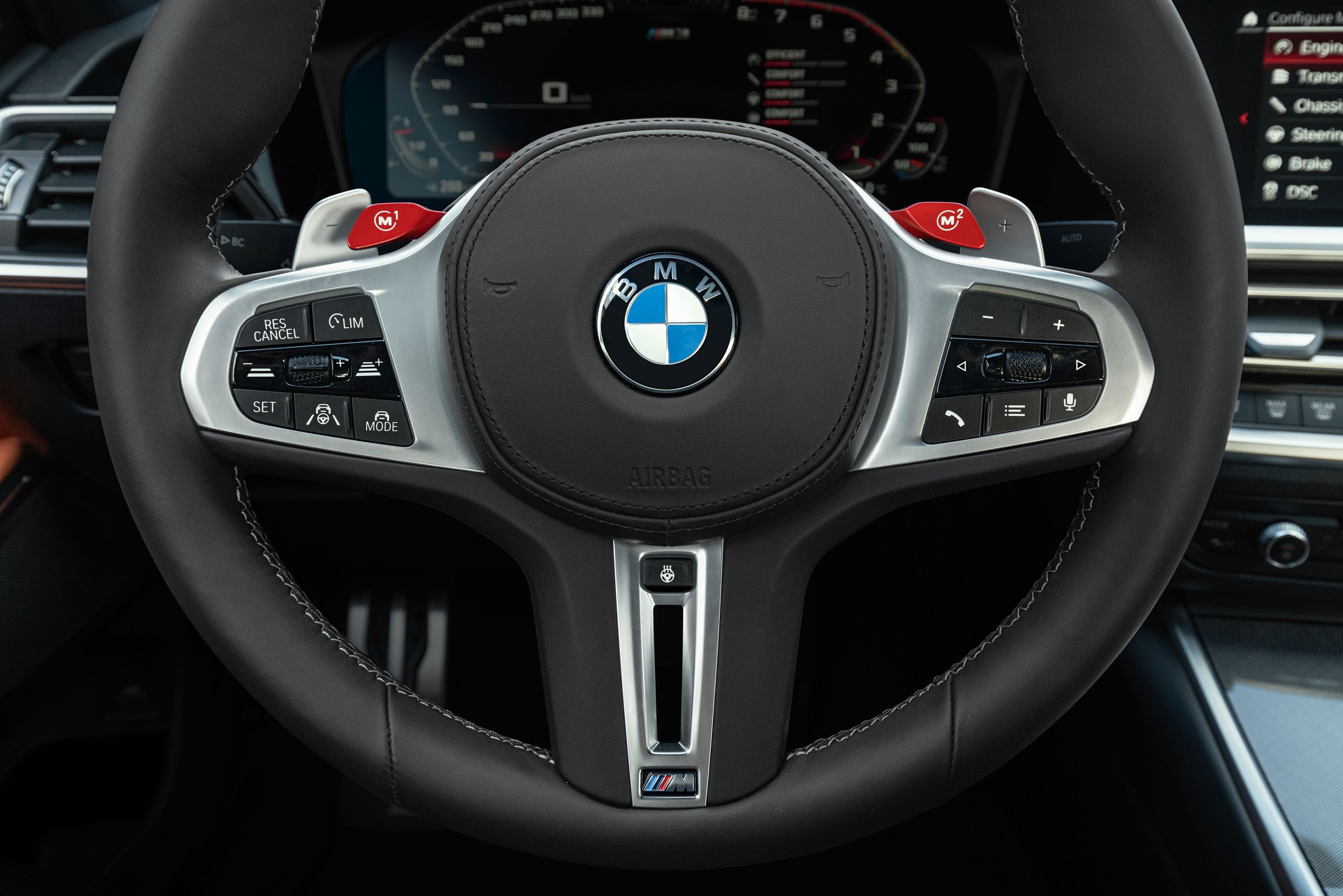 The steering wheel of the 2021 BMW M3.