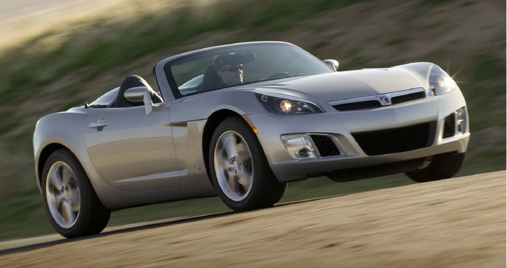 Silver Saturn Sky Red Line on the road