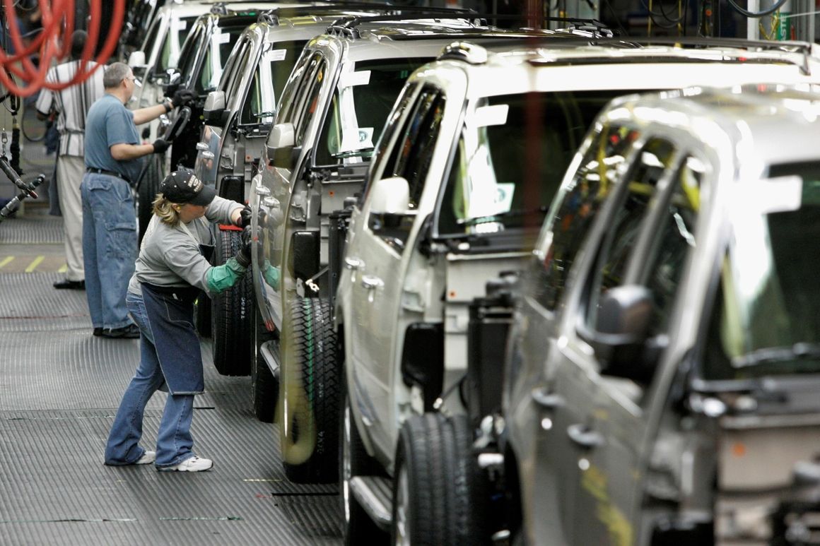 Workers assemble General Motors vehicles at the GM auto assembly plant in Arlington, Texas