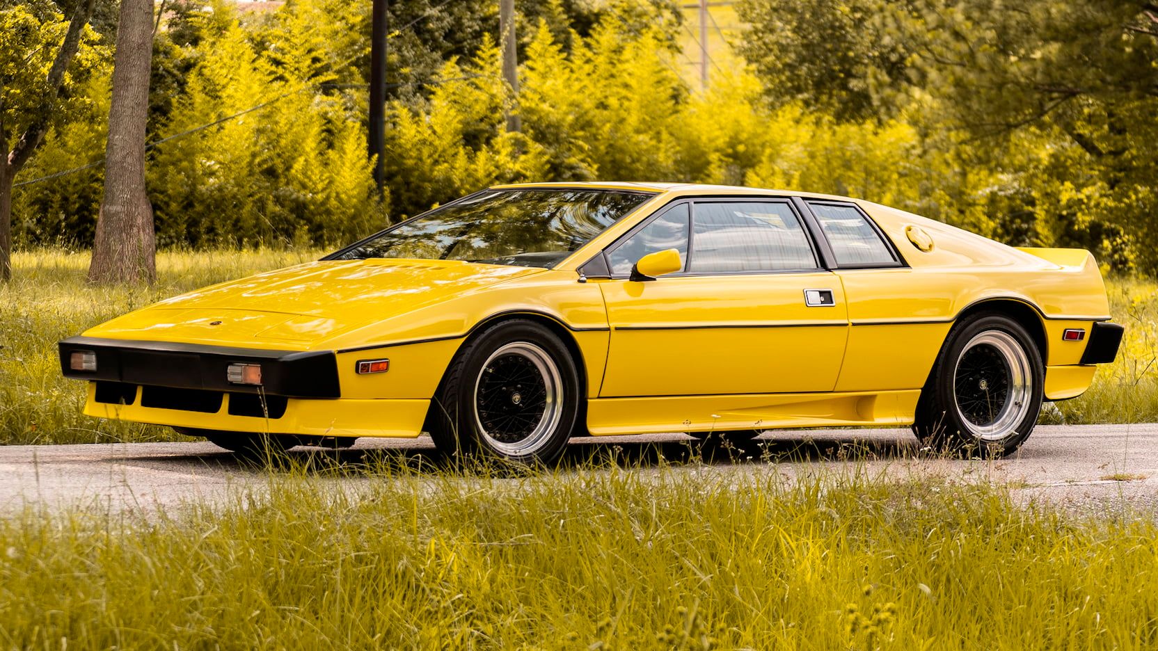 Yellow 1976 Lotus Esprit Series I on the road