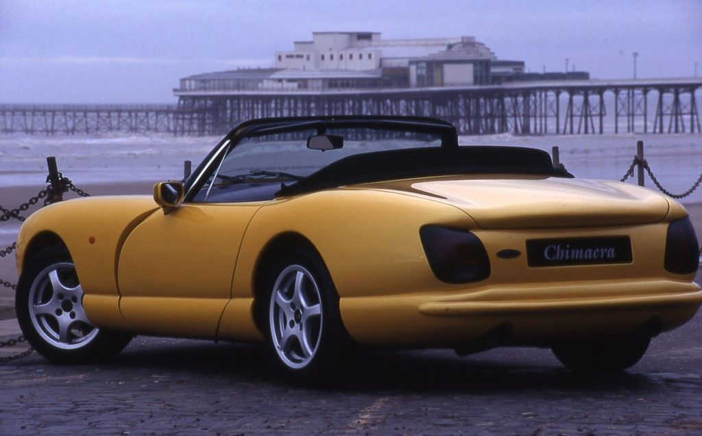 Yellow 1994 TVR Chimaera 450 Convertible on the road