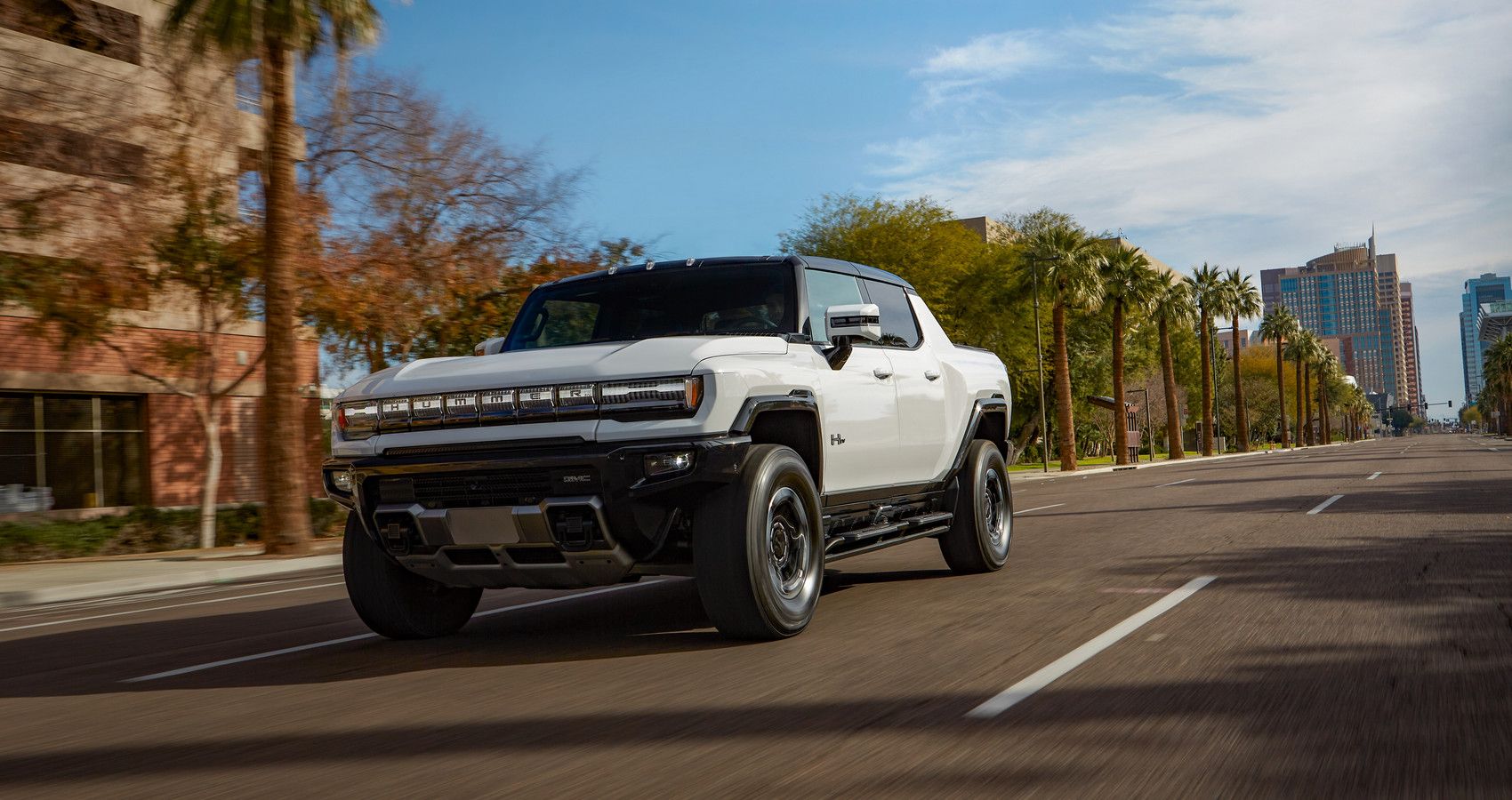 GMC Hummer EV pickup on the road front third quarter view